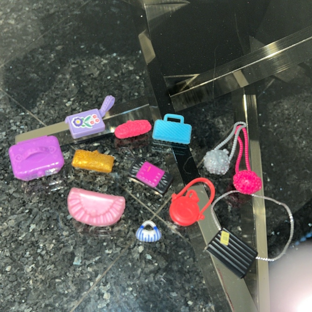 12 vintage Barbie clutch/shoulder bags.